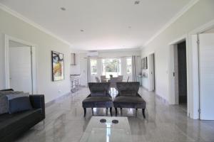 a living room with a couch and a table at Caribbean 1136 by Top Destinations Rentals in Port Edward