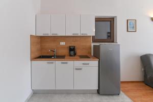 Kuchyň nebo kuchyňský kout v ubytování Apartments Andrea I