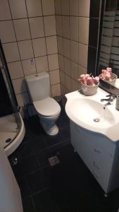 a bathroom with a toilet and a sink at La bella casa thassos in Limenas +43 photos