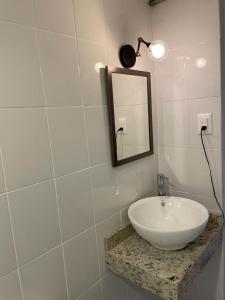 a bathroom with a white sink and a mirror at Departamento centro de Boca del Río in Boca del Río