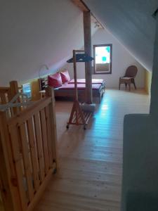 a bedroom with a bunk bed and a wooden floor at Ferienhaus Wehretal 