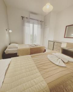 A bed or beds in a room at Banos Apartments and swimming pool