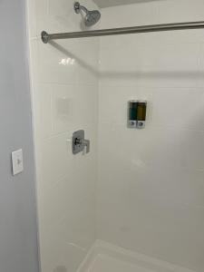 a bathroom with a shower with a glass door at South Seas Ocean Front in Myrtle Beach +25 photos