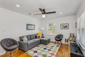 a living room with a couch and two chairs at 323 W Zarragossa in Pensacola