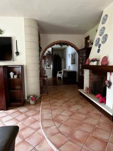 a living room with a hose on the floor at Villa Porto Selvaggio in Santa Caterina di Nardò