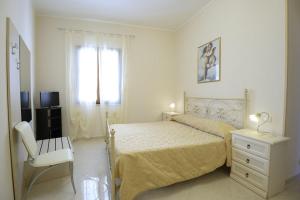 Ein Bett oder Betten in einem Zimmer der Unterkunft Case Vacanza Edera