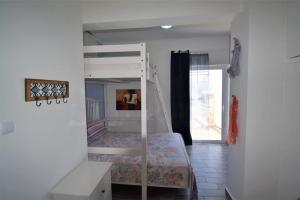 a bedroom with a bunk bed in a room at Eleni Penthouse Loutraki in Loutraki