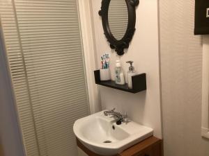 a bathroom with a sink and a mirror at Holiday Home At Seton Sands in Port Seton