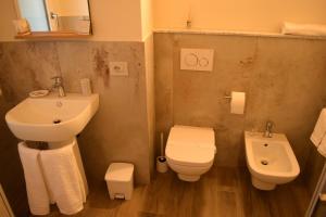 a small bathroom with a sink and a toilet at B&B Da Nora in Mallare