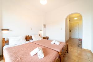 Postel nebo postele na pokoji v ubytování Arianna Studio Ground Floor 1