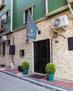 a building with a flag on the side of it at The Abies in Canakkale