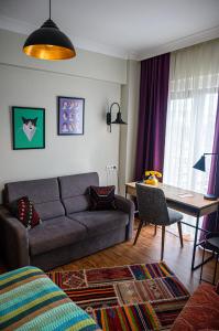 a living room with a couch and a table at The Abies in Çanakkale