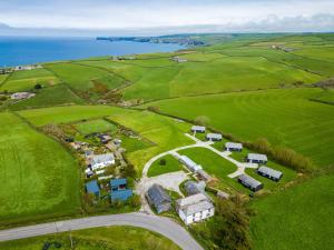 an aerial view of a farm near the ocean at Puffin Lodge in Port Isaac