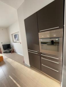 a kitchen with a stainless steel oven in a room at Casa Marì in Ostuni