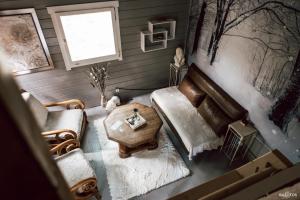 an overhead view of a living room with a couch and a table at Cabane insolite avec escape game in Saint-Évarzec