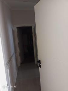 an empty hallway with a door in a room at Dublex house - near the Airport and sea and in the city in Dalaman