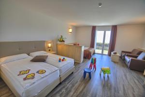 Postel nebo postele na pokoji v ubytování Hotel Le Balze - Aktiv & Wellness