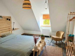 a dog sitting on a table next to a bed at Boho Apartment in der Stadtmitte in Lahr