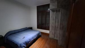 Säng eller sängar i ett rum på Disfruta de Mendoza