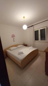 Postel nebo postele na pokoji v ubytování Apartment Marija Marina