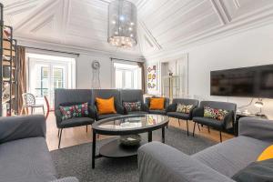 a living room with a couch and a table at Bairro Alto Palace Special for Groups in Lisbon