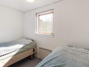 Postel nebo postele na pokoji v ubytování Holiday home Skals VI