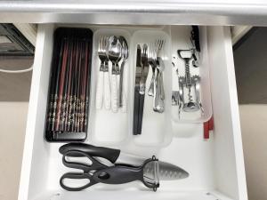a white drawer filled with utensils and a pair of scissors at Classic/modern Japanese-style 2rooms/3mins to Sta/8P in Tokyo