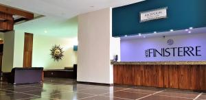 a lobby of an office with a sign on the wall at Hotel Finisterre in Mexico City