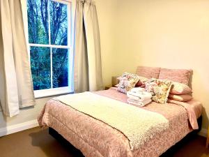Posteľ alebo postele v izbe v ubytovaní City Garden Retreat