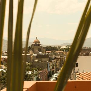 a view of a city from the roof of a building at Quinta Roca Hotel in Oaxaca City