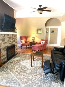 a living room with a couch and a fireplace at Grafton Lodge in Lake Lure