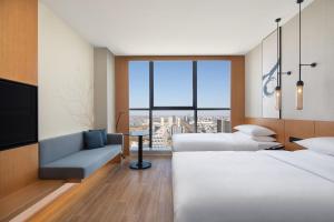 Postel nebo postele na pokoji v ubytování Fairfield by Marriott Shijiazhuang High-Tech Zone