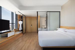Postel nebo postele na pokoji v ubytování Fairfield by Marriott Shijiazhuang High-Tech Zone