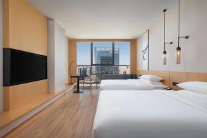 Postel nebo postele na pokoji v ubytování Fairfield by Marriott Shijiazhuang High-Tech Zone