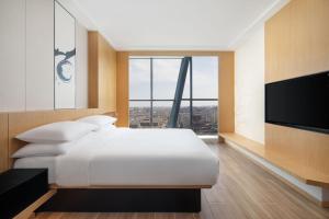 Postel nebo postele na pokoji v ubytování Fairfield by Marriott Shijiazhuang High-Tech Zone
