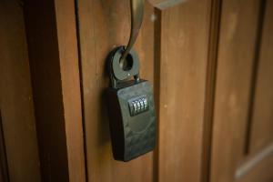 a close up of a padlock on a wooden door at Log House Kizuki - Vacation STAY 62486v in Tsuru 