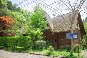 a house with a sign in front of it at Log House Kizuki - Vacation STAY 62486v in Tsuru 