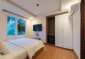 TV a/nebo společenská místnost v ubytování Khách sạn CLIFFHOUSE NHA TRANG