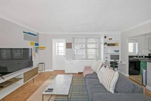 a living room with a couch and a kitchen at 21st floor condo in the center of Atlanta in Atlanta