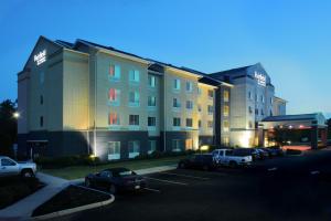 a large building with cars parked in a parking lot at Fairfield Inn & Suites by Marriott Millville Vineland in Millville