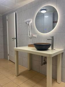 a bathroom with a sink and a mirror at 夏綠房 in Fengyuan