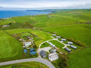 an aerial view of a farm near the ocean at Atlantic Lodge in Port Isaac