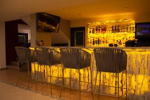 a group of chairs sitting at a table in a room at Hotel Casa Real Cholula in Cholula