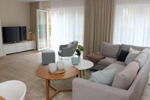 TV a/nebo společenská místnost v ubytování Strandvilla Birkenallee Haus Meerzeit