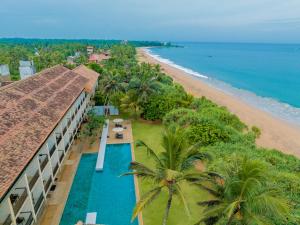 an aerial view of a hotel and the beach at Temple Tree Resort & Spa in Bentota