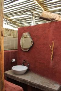 a bathroom with a sink and a mirror at Mount D'Urban Campsite in Helmeringhausen