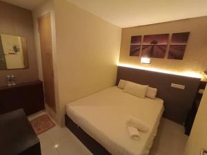 Letto o letti in una camera di One Point Hotel