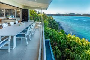a house with a view of the ocean at North Cape 5 on Hamilton Island by HIHA in Hamilton Island