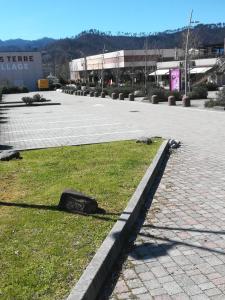 a empty parking lot with a building in the background at Relax Brugnato in Brugnato