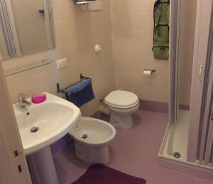 a bathroom with a sink and a toilet and a shower at B&B La Galleria in Palermo
